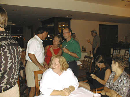 Cheryl Cheek Collier, Kathy Callaway Birch, and Joyce Swinney McKinney swap tales while Rick Sewell, Kathy King Terry and Jeff Hulsey visit in the background